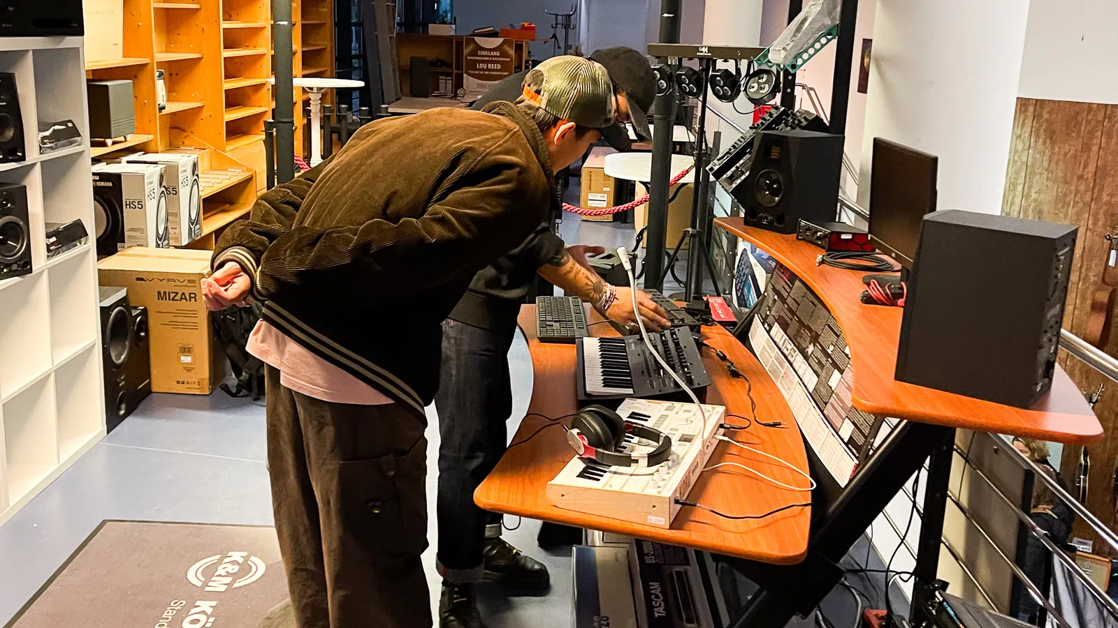 Testing at a desk with a keyboard, a mixer and speakers