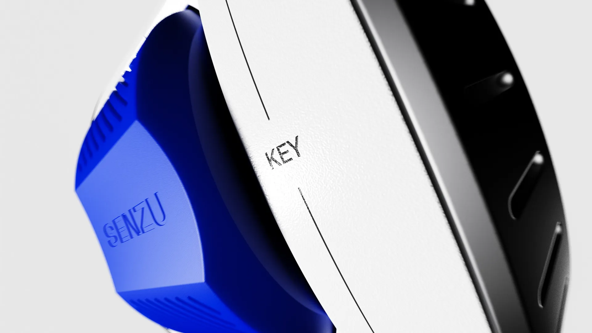 Close-up render of a blue key body under the ribbed ring, marked KEY
