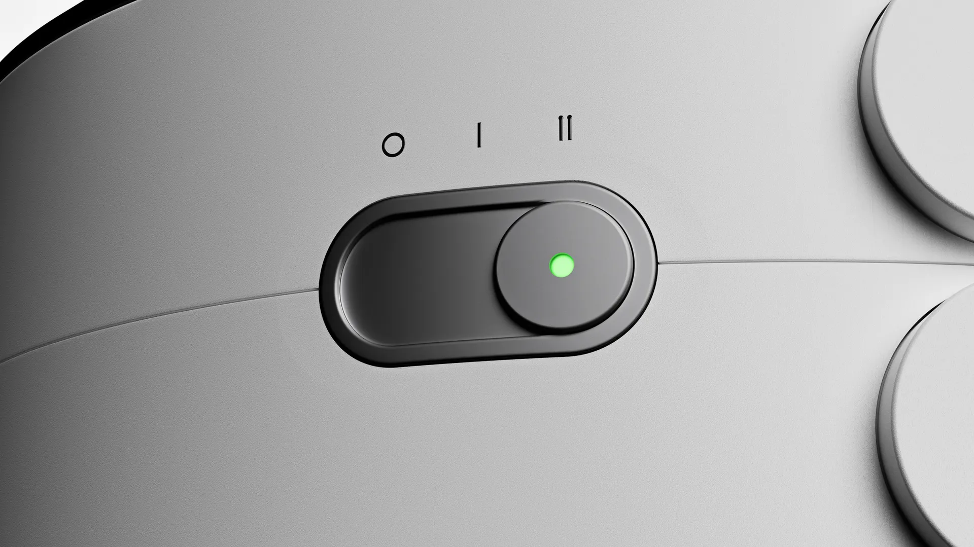 Close-up render of the slide switch with three positions and a green light